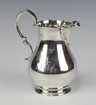 A Victorian engraved silver cream jug of baluster form London 1873 by Richard Brown (Charles Brown), 206 grams 