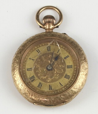 A keyless fob watch contained in a gilt metal case 