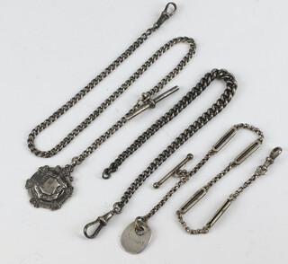 A silver curb link watch chain 22cm, a silver curb link watch chain hung a sports medallion 37cm, a silver langtree style watch chain hung a fob 22cm, 47.2 grams 