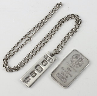 A silver ingot pendant London 1977 hung on a silver belcher link chain, together with a silver ingot marked Angor Heraeus Switzerland, 46.1 grams