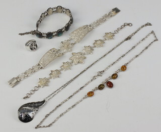 A silver dress ring decorated a rampant lion, a niello pendant on chain, 2 filigree bracelets, a necklace set "amber" and a silver bracelet set abalone shell  