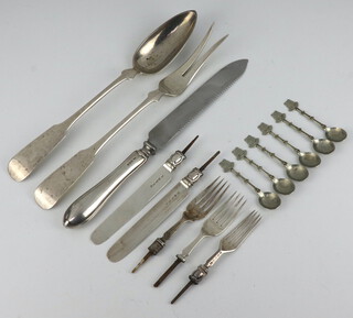 A pair of Sterling fiddle pattern salad servers, 186 grams, a silver handled cake knife, 6 Continental spoons, 2 silver bladed fruit knives and ditto forks