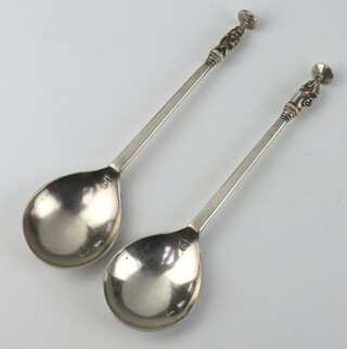 A pair of Continental white metal apostle style table spoons  