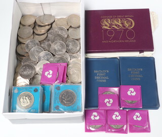 Two 1970 proof sets of coins and a collection of 1981 Royal Wedding crowns, various Churchill crown etc 