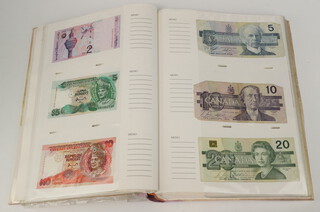 A quantity of World bank notes contained in an album 