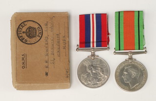 A pair of Second World medals - British War medal and Defence medal with original postage box attributable to R H Townend 