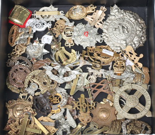 A quantity of cap badges including Argyle and Sutherland Highlanders, The Highland Regt. etc, 