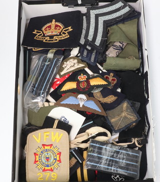 A collection of Naval and RAF cloth insignia including epaulettes 