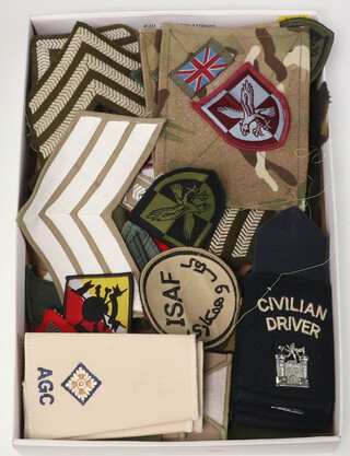 A collection of military rank slides, stripes, cloth insignia 