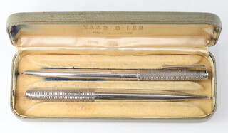 A Yard O Led propelling pencil and ditto ballpoint pen contained in silver cases, Birmingham 1961, cased 