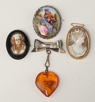 A shell carved cameo brooch in a 9ct mount, silver bar brooch with "amber" coloured heart shaped pendant and 2 other brooches  