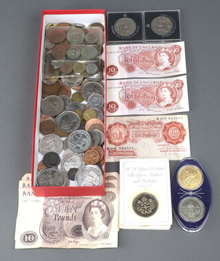 Three brown ten pound notes (folded), 3 ten shilling notes and a quantity of mixed coinage