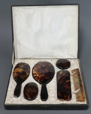 A 1930's 6 piece simulated tortoiseshell dressing table set comprising hand mirror, hair brush, 2 soap dishes, clothes brush and comb, boxed (hinges to box a/f)  