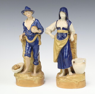 A pair of Royal Dux bisque porcelain spill vases in the form of a standing boy and girl, the base with triangular pink Royal Dux mark 26cm 