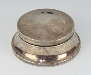 A circular silver dressing table trinket box with domed lid and waisted form, Birmingham 1925 4cm h x 3cm diam., marks rubbed 