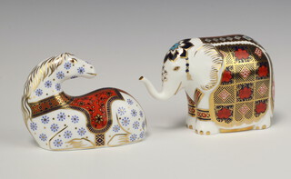 Two Royal Crown Derby Imari pattern paperweights - seated horse with gold stopper L111 8cm, elephant with gold stopper LX1 11cm 