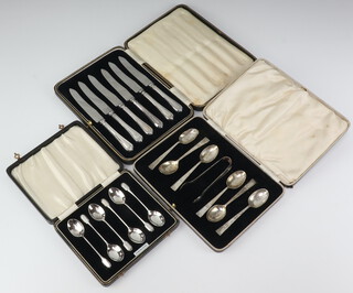 A set of 6 silver coffee spoons Birmingham 1915, a set of 6 silver coffee spoons and sugar tongs (1 spoon f), a set of 6 silver handled tea knives, all boxed, weighable silver 124 grams 