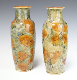 A pair of Royal Doulton vases decorated leaves, the bases impressed Royal Doulton, X85317 2406, incised JH X 29cm 