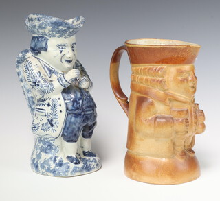 A Royal Doulton salt glazed Toby jug the base impressed 3578 21cm together with a 19th Century faience Toby jug of Toby Philpott taking snuff 25cm  