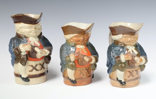 Three graduated Royal Doulton Lambeth pottery Toby jugs of Toby Philpott astride a barrel marked XX bases impressed Royal Doulton Lambeth 589 19cm, 16cm and 16cm 