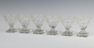 Six 19th Century circular cut glass table salts raised on square bases 9cm 