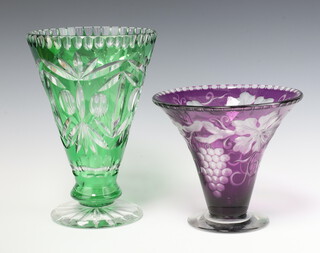 A Bohemian green glass trumpet shaped vase, raised on a spreading foot 26cm together with a purple ditto 17cm 