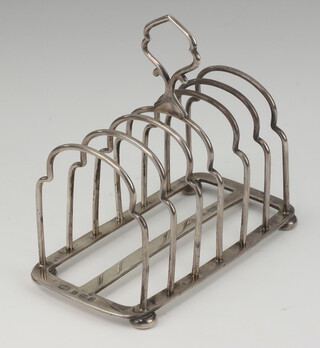 A silver 7 bar toast rack on bun feet, Birmingham 1940, 180 grams 
