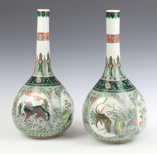A pair of 19th Century Chinese famille vert porcelain club shaped vases of panelled decoration, decorated animals, 44cm 