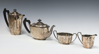 An oval silver 4 piece tea service comprising teapot, hot water jug, twin handled cream jug and sugar bowl, Birmingham 1966, gross weight 1712 grams 