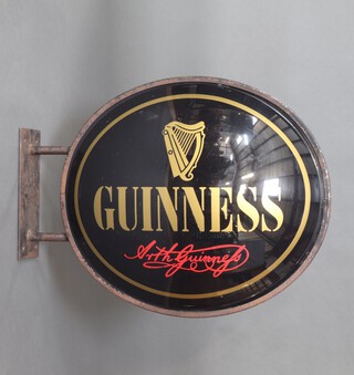 Guinness, a plastic and metal framed double sided hanging sign marked Arthur Guinness 91cm h x 70cm diam. 