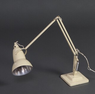 Herbert Terry, a white anglepoise lamp, raised on a stepped square base, 62cm x 15cm x 15cm 