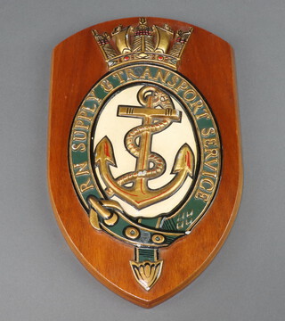 A Royal Navy Supply and Transport Service wall plaque 32cm x 19cm 