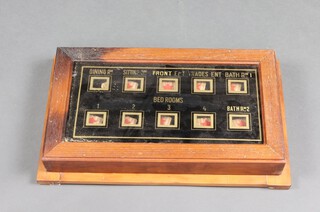 A 1930's ten aperture servants bell indicator board - dining room, sitting room, front entrance, trade entrance,  bathroom one, bedroom, bathroom two, bedrooms one to four 8cm x 45cm x 27cm 