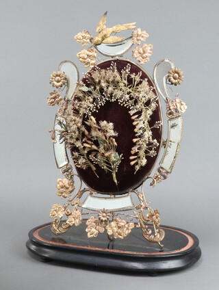 An Edwardian bridal headdress mounted on an embossed gilt metal and mirrored display stand, top surmounted by a bird 47cm x 30cm 