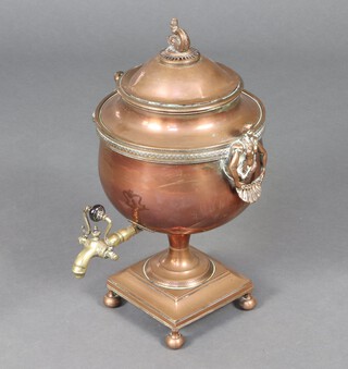 A Regency copper twin handled tea urn with dolphin finial on square base with bun feet 48 cm x 28cm 