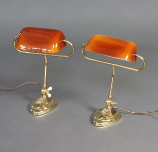 A pair of Christopher Wray gilt metal bank lights with amber shades 39cm x 33cm 