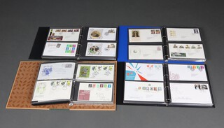 Four albums of Elizabeth II GB first day covers