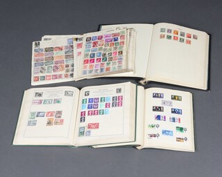 A Capital album of used stamps including Hungary, German, France, Egypt, a green album of world stamps - GB Victoria to Elizabeth II, a Standard album of world stamps and a black album of Elizabeth II GB and world stamps