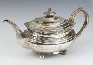 A George III oval silver teapot raised on bun feet Newcastle 1798 by James Bell 683 grams 