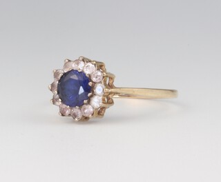 A 9ct yellow gold dress ring set a sapphire supported by diamonds, size S, gross weight 2.2g
