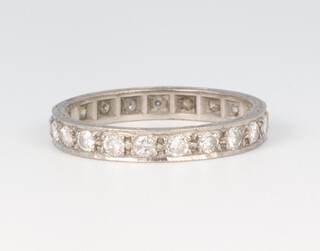 A white metal 18ct full eternity ring set diamonds, each diamond approx. 0.4ct, size Q, 3.2 grams 