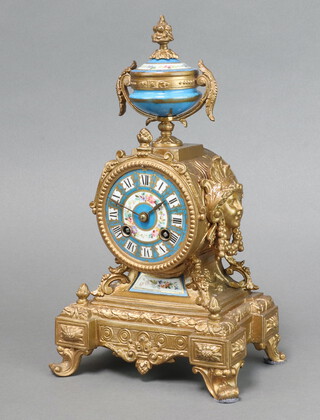 A 19th Century  French 8 day striking mantel clock with blue and floral patterned porcelain dial contained in a gilt painted spelter case surmounted by an urn 30cm h x 18cm x 12cm 