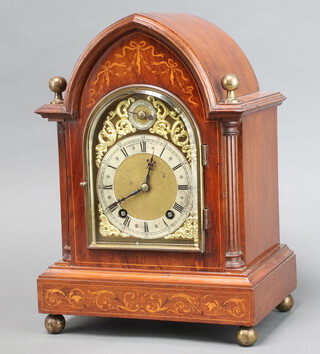 Winterhalder and Hofmeier, a 19th Century striking bracket clock, the 14cm arched gilt dial marked Pooley and Sons Ealing with silvered chapter ring, Roman numerals, contained in an inlaid mahogany arch shaped case complete with pendulum and key 36cm h x 25cm w x 18cm d 