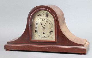 A 1920's German striking mantel clock, the 15cm arched dial with slow, fast and silent indicator, Arabic numerals, contained in a mahogany Admiral's hat shaped case complete with pendulum and key 30cm h x 54cm w x 18cm d 