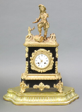 A 19th Century French 8 day mantel clock with 8cm enamelled dial, Roman numerals, contained in a gilt metal case surmounted by a figure of a gentleman standing on a drum, with pendulum but no key  51cm h x 25cm w x 13cm d 