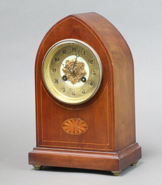 A French 8 day striking mantel clock with 11cm circular gilt dial, Arabic numerals, contained in an inlaid mahogany lancet case 29cm h x 19cm w x 11cm d, complete with pendulum 