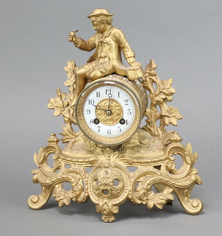 A 19th Century French 8 day striking mantel clock with 8cm porcelain dial, Arabic numerals contained in a gilt painted spelter case surmounted by a figure of seated fisherman with creel 30cm h x 26cm w x 11cm d, complete with pendulum 