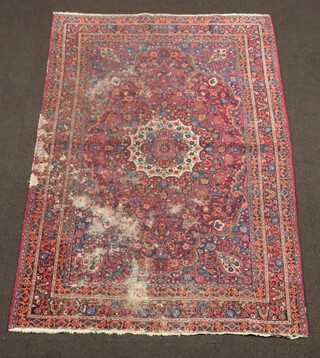 A blue and red ground Persian rug with central medallion 208cm x 136cm 