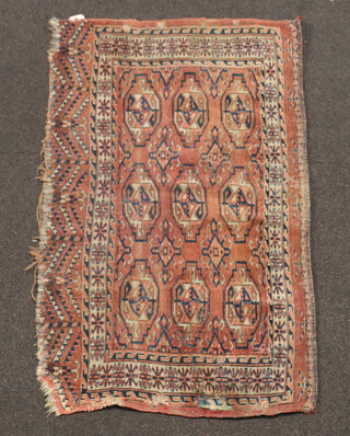 A section of red and blue ground Bokhara rug 110cm x 65cm