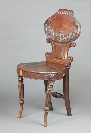 A Georgian mahogany carved hall chair with oval shaped back and seat, raised on turned and fluted supports 89cm h x 42cm w x 36cm d (seat 26cm x 21cm)  
